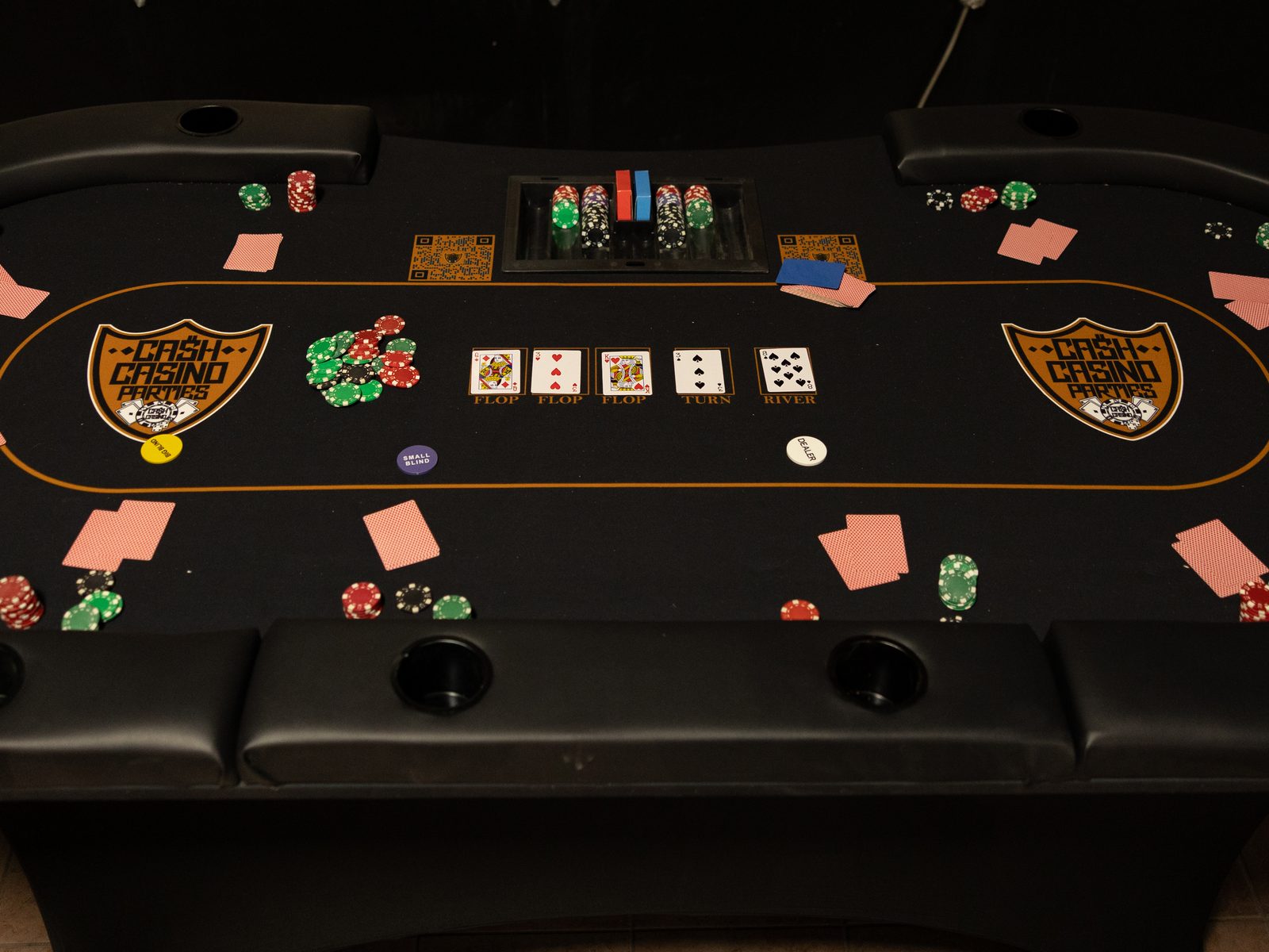 Full-size Texas Hold'em table with a professional dealer at a casino party
